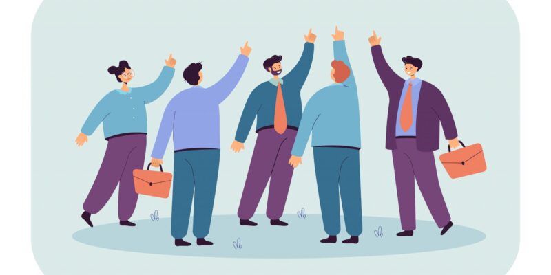 Team-of-people-pointing-fingers-upward-scaled